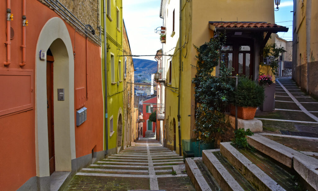 A narrow street between the old buildings of the medieval town Campobasso