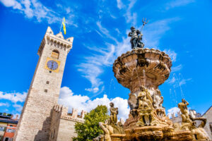 Neptune fountain in Trento and the Torre di Piazza