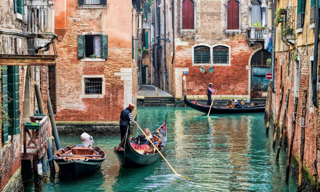 Typical Venetian Gondolas in the Canals of Venice