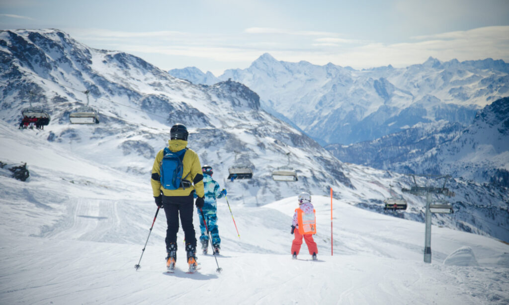 Landscape of the snow-covered mountains and skiers in Cervinia