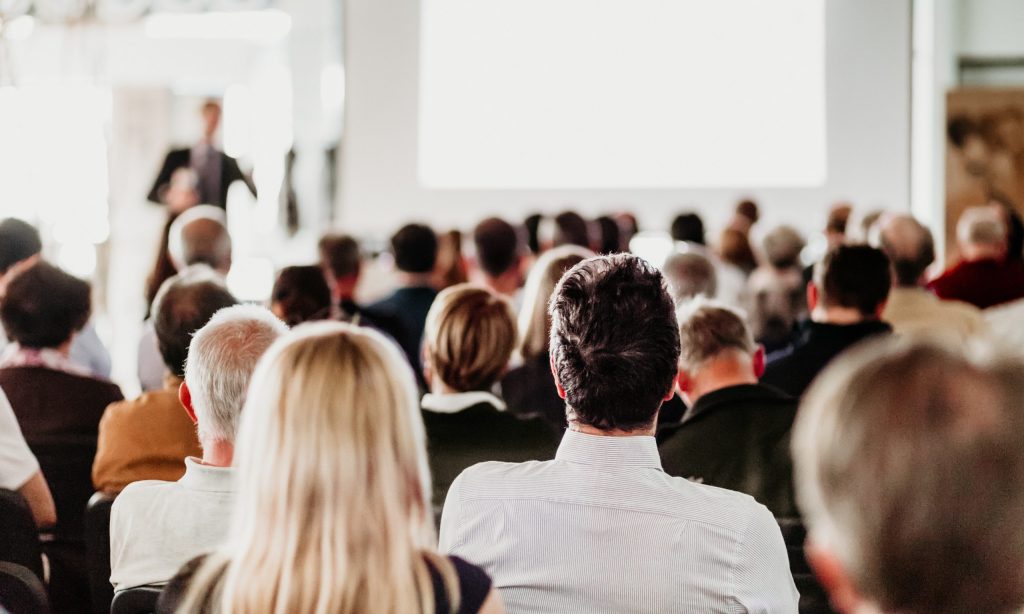 Audience in the lecture hall during a seminar in Italy.