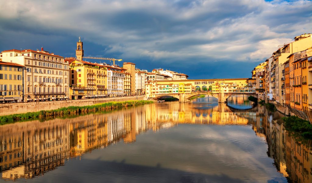 View of medieval stone bridge Ponte Vecchio over Arno river in Florence, Tuscany, Italy. Beautiful Florence after the rain. Florence architecture and landmark.