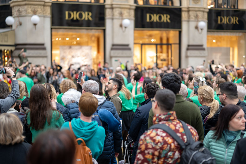 Big group of people in front of shops in Milan.