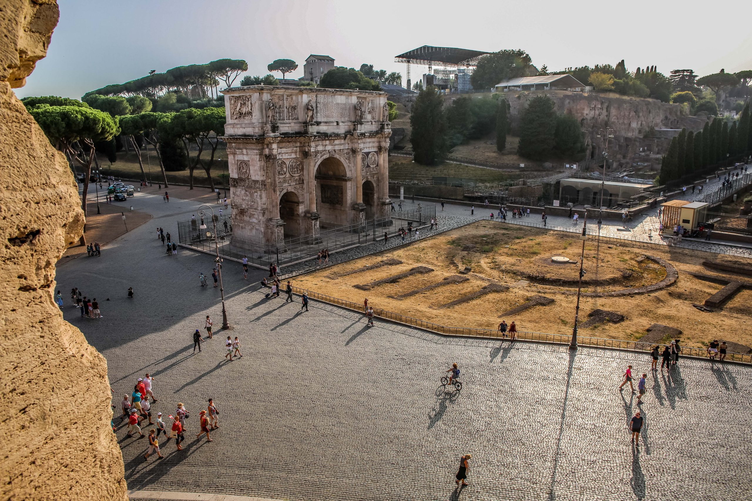 View Forum Romanum in Rome with tourists walking around.