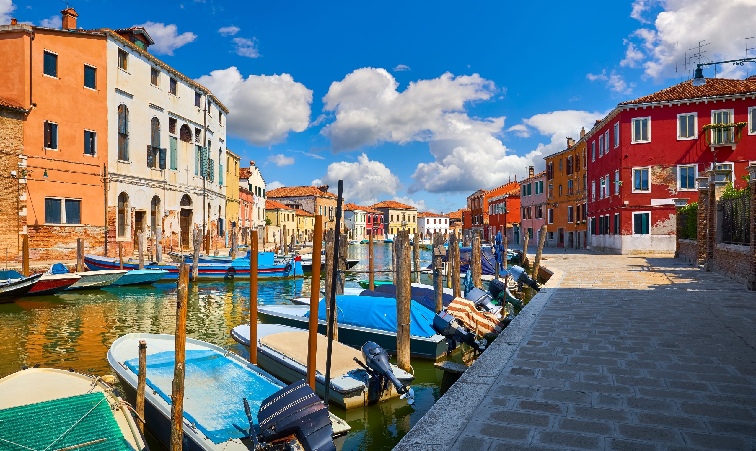 Boats and colorful houses in Murano, Italy