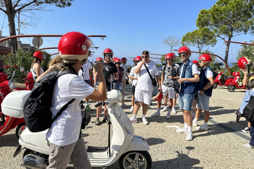 Group of people ready for the Vespa Tour.