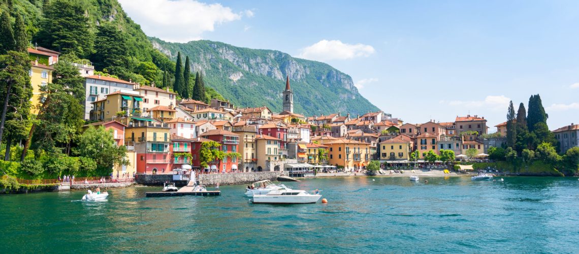 Varenna Lago Como Italy, colorful houses and boats on the water.