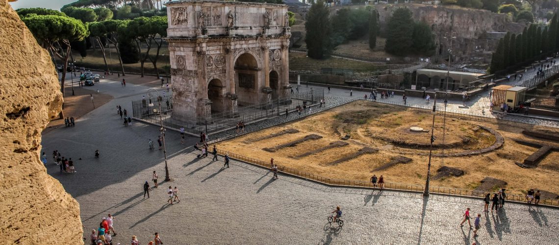 View Forum Romanum in Rome with tourists walking around.