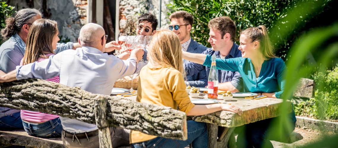 Group of people or team having lunch outdoors.